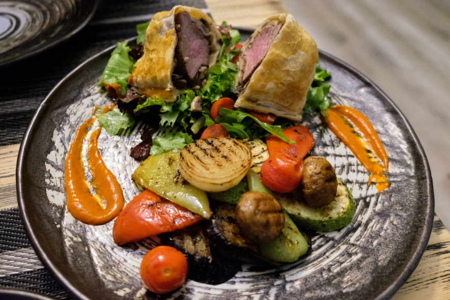 A typical Uzbek meal - grilled vegetables, meat wrapped in bread.